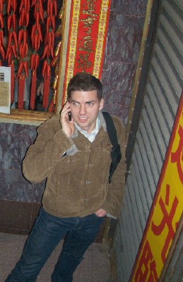 Tom phones home from Chinatown.